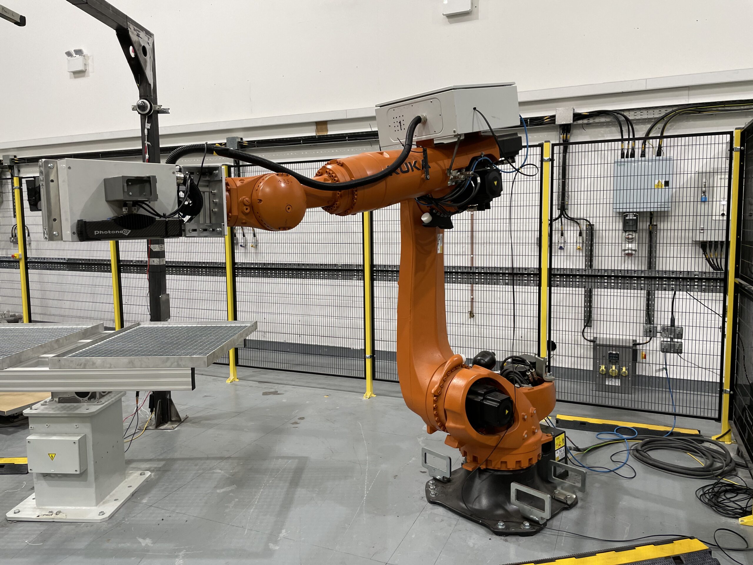 Orange robot arm used for autonomous nuclear waste sorting