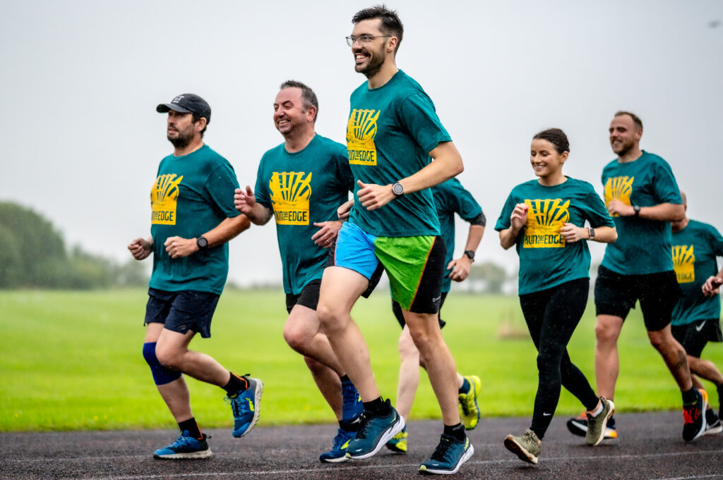 7 people running at Milliom Striders running club